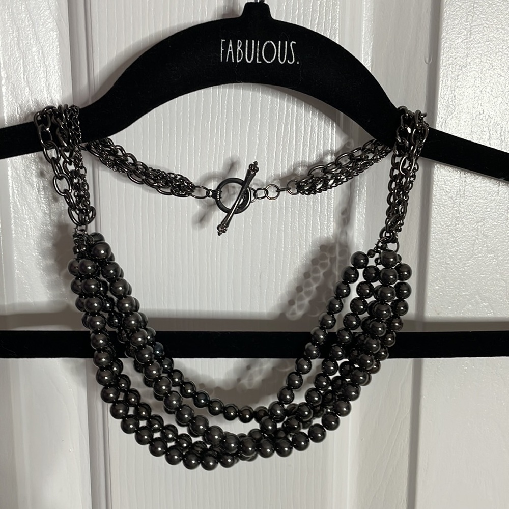 Charcoal gray / blackish decorative pearl necklace.